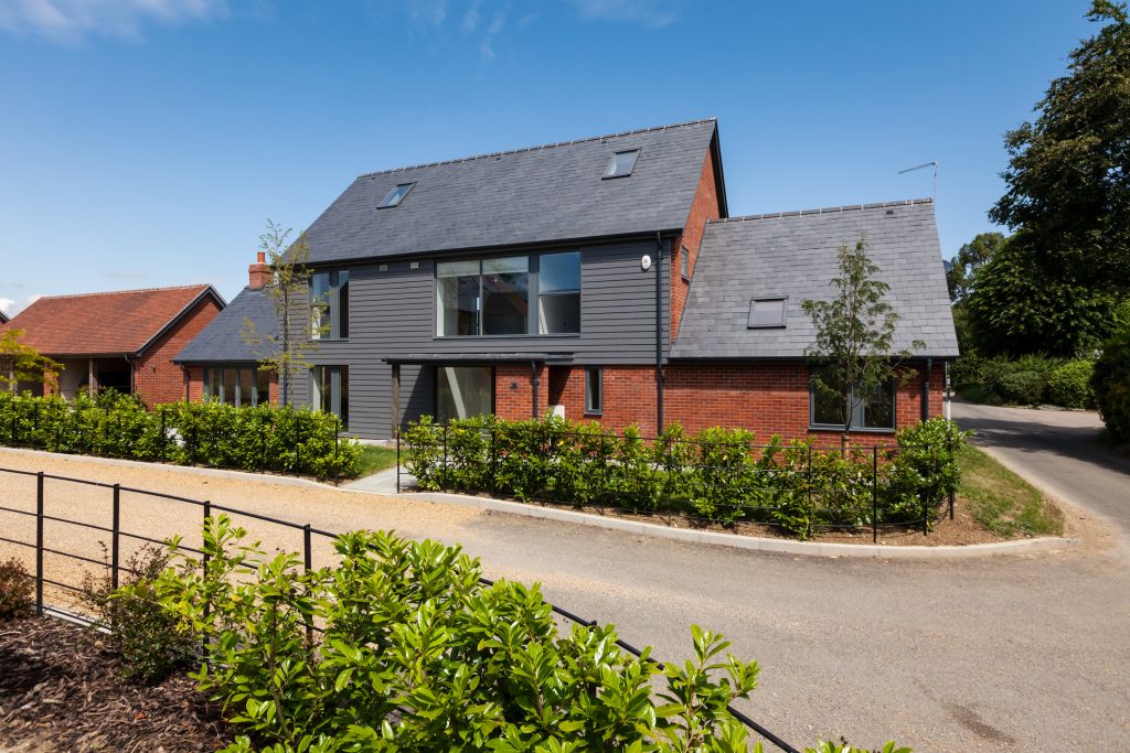 House with cladding on exterior - Assured Composite