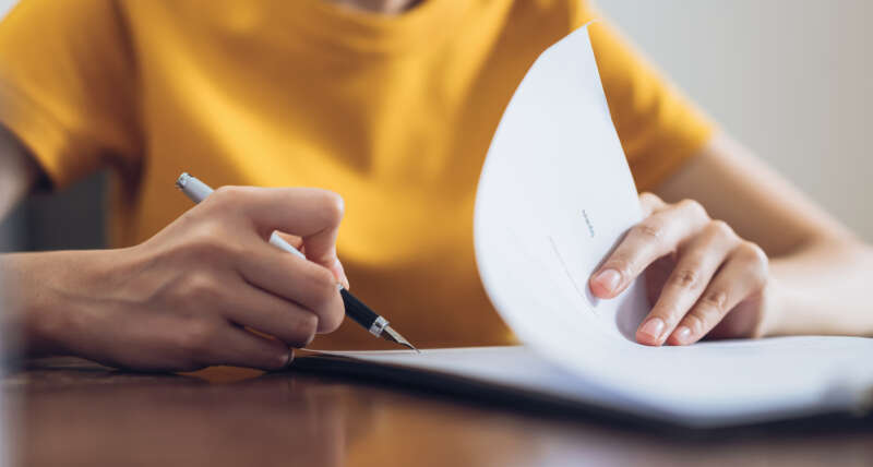 Woman signing document for planning permission